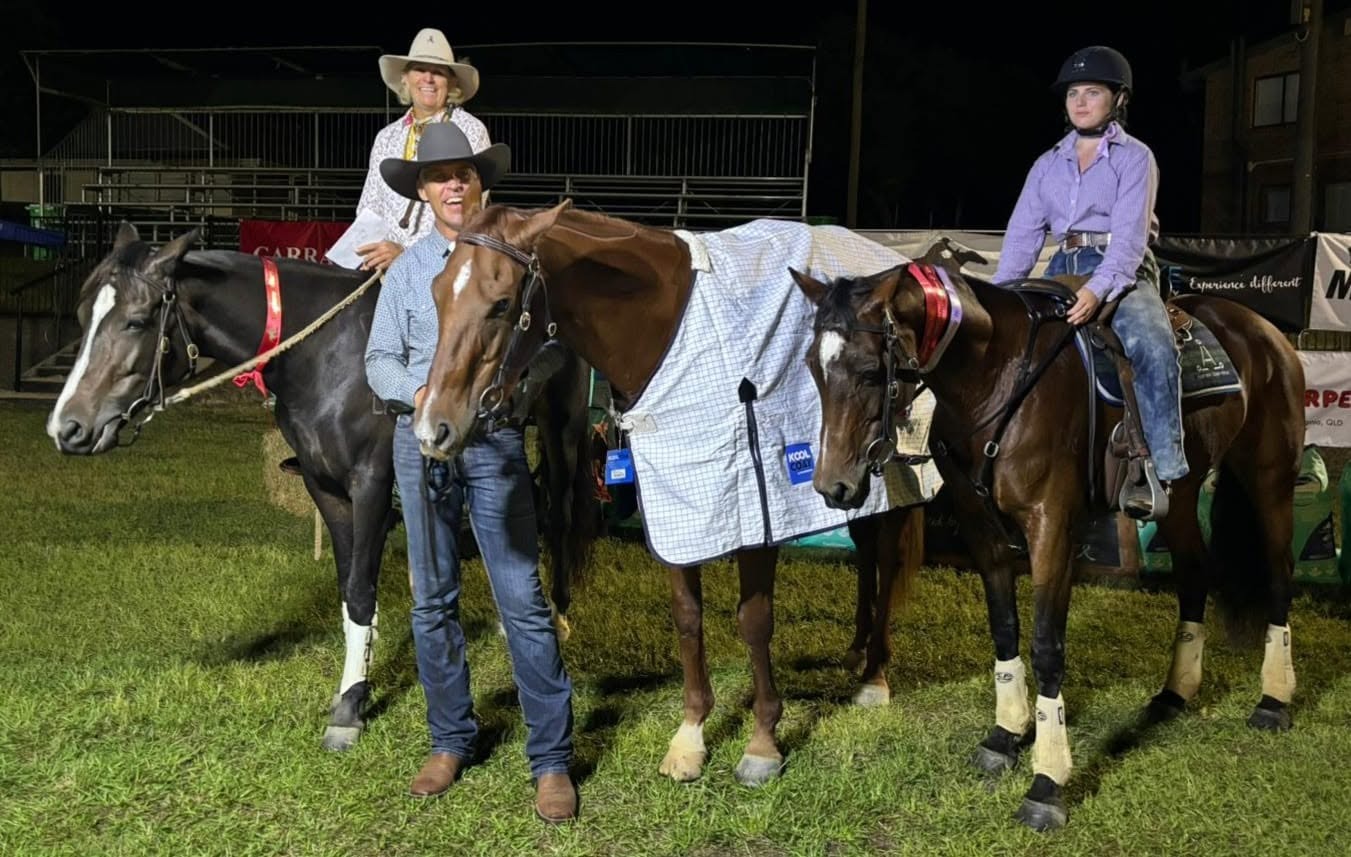 Horses and riders at an evening show, rugged and ready to go home
